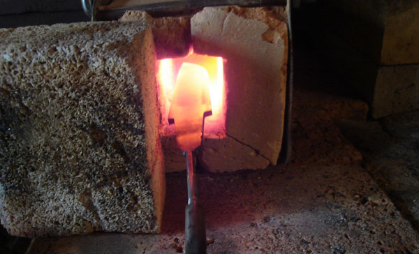 Quenching a knife in the furnace