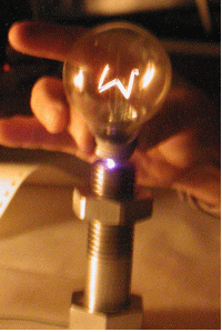 The glow of the incandescent lamp is 220V, 25W in the hand.